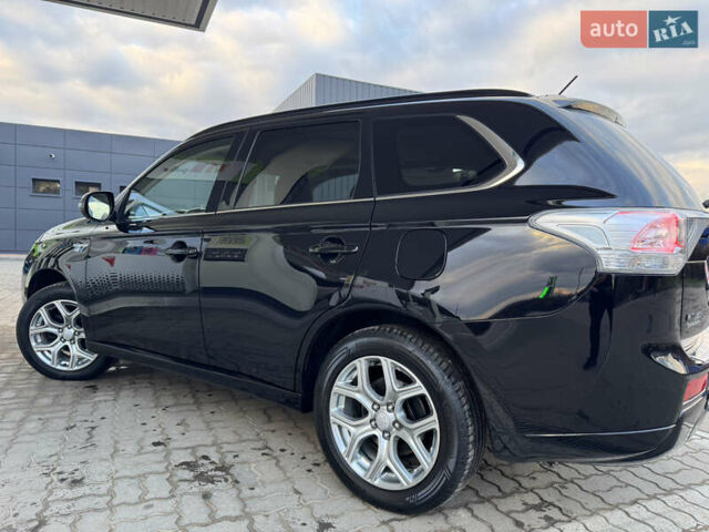 Чорний Міцубісі Аутлендер, об'ємом двигуна 2 л та пробігом 157 тис. км за 15299 $, фото 63 на Automoto.ua