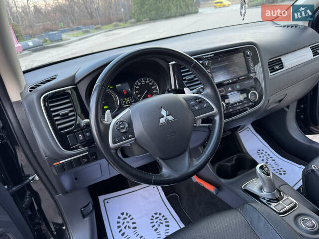 Чорний Міцубісі Аутлендер, об'ємом двигуна 2 л та пробігом 157 тис. км за 15299 $, фото 74 на Automoto.ua