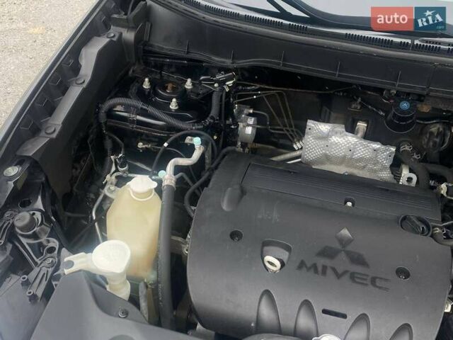 Чорний Міцубісі Аутлендер, об'ємом двигуна 2 л та пробігом 250 тис. км за 10800 $, фото 21 на Automoto.ua