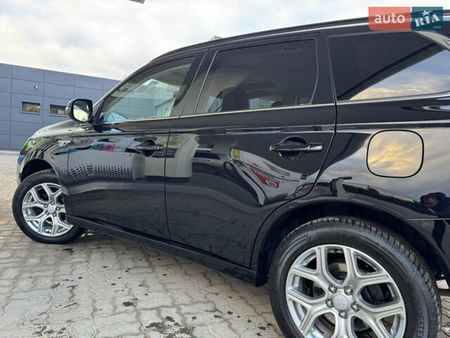 Чорний Міцубісі Аутлендер, об'ємом двигуна 2 л та пробігом 157 тис. км за 15299 $, фото 64 на Automoto.ua