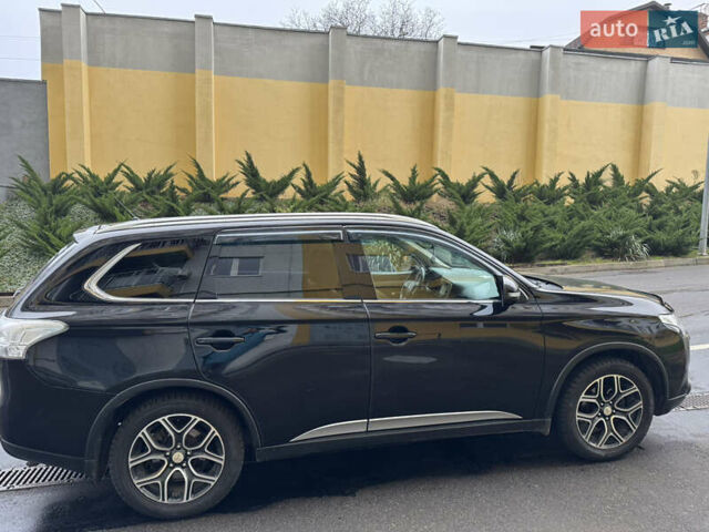 Черный Мицубиси Аутлендер, объемом двигателя 2.27 л и пробегом 244 тыс. км за 14000 $, фото 1 на Automoto.ua