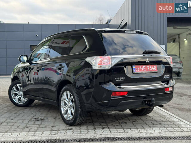 Чорний Міцубісі Аутлендер, об'ємом двигуна 2 л та пробігом 157 тис. км за 15299 $, фото 55 на Automoto.ua