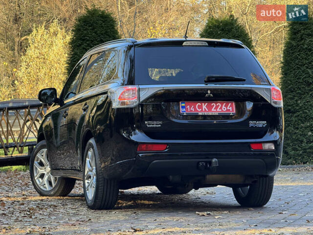 Чорний Міцубісі Аутлендер, об'ємом двигуна 2 л та пробігом 173 тис. км за 15299 $, фото 61 на Automoto.ua