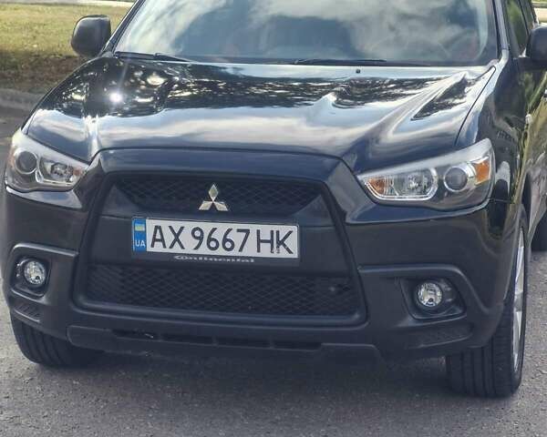 Чорний Міцубісі Аутлендер, об'ємом двигуна 2 л та пробігом 83 тис. км за 13500 $, фото 16 на Automoto.ua