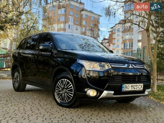 Черный Мицубиси Аутлендер, объемом двигателя 2.4 л и пробегом 270 тыс. км за 12500 $, фото 1 на Automoto.ua