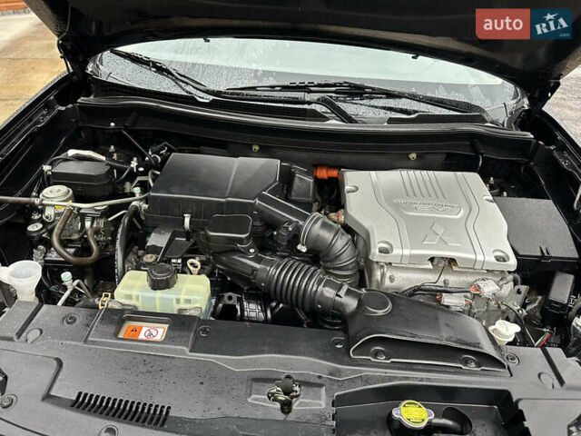Черный Мицубиси Аутлендер, объемом двигателя 2 л и пробегом 223 тыс. км за 13400 $, фото 23 на Automoto.ua