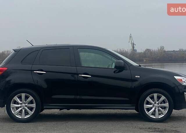 Чорний Міцубісі Аутлендер, об'ємом двигуна 2 л та пробігом 250 тис. км за 10800 $, фото 6 на Automoto.ua