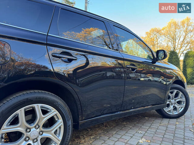Чорний Міцубісі Аутлендер, об'ємом двигуна 2 л та пробігом 173 тис. км за 15299 $, фото 56 на Automoto.ua