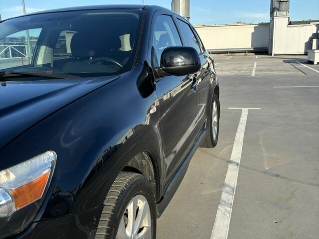 Черный Мицубиси Аутлендер, объемом двигателя 2 л и пробегом 105 тыс. км за 9999 $, фото 1 на Automoto.ua