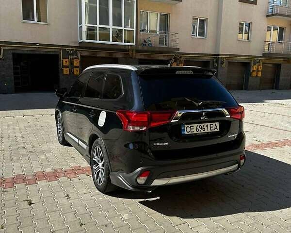 Чорний Міцубісі Аутлендер, об'ємом двигуна 2.36 л та пробігом 225 тис. км за 13699 $, фото 7 на Automoto.ua