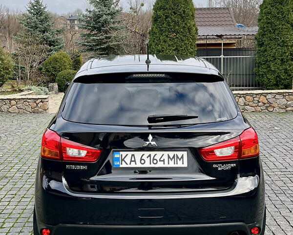 Чорний Міцубісі Аутлендер, об'ємом двигуна 2 л та пробігом 170 тис. км за 10999 $, фото 13 на Automoto.ua