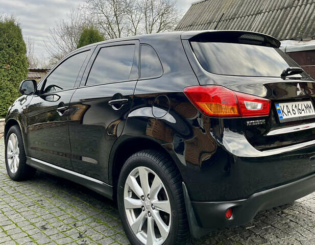 Чорний Міцубісі Аутлендер, об'ємом двигуна 2 л та пробігом 170 тис. км за 10999 $, фото 12 на Automoto.ua