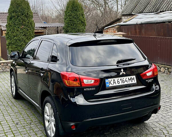 Чорний Міцубісі Аутлендер, об'ємом двигуна 2 л та пробігом 170 тис. км за 10999 $, фото 10 на Automoto.ua