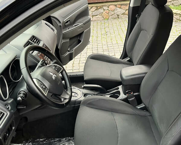 Чорний Міцубісі Аутлендер, об'ємом двигуна 2 л та пробігом 170 тис. км за 10999 $, фото 20 на Automoto.ua