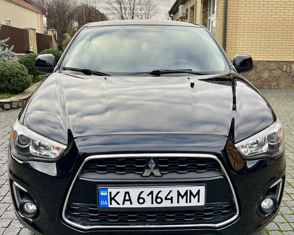 Чорний Міцубісі Аутлендер, об'ємом двигуна 2 л та пробігом 170 тис. км за 10999 $, фото 16 на Automoto.ua