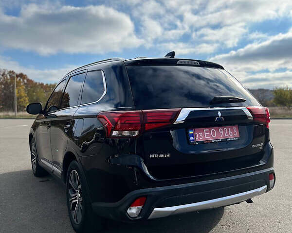 Черный Мицубиси Аутлендер, объемом двигателя 2.36 л и пробегом 91 тыс. км за 15500 $, фото 2 на Automoto.ua