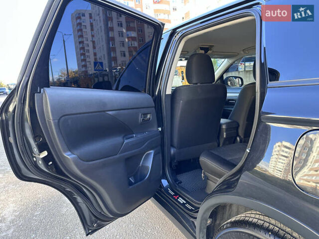 Черный Мицубиси Аутлендер, объемом двигателя 2.36 л и пробегом 150 тыс. км за 14900 $, фото 24 на Automoto.ua