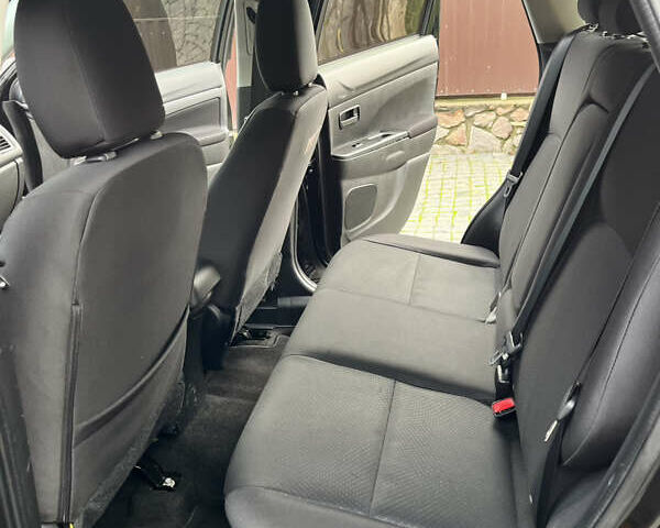 Чорний Міцубісі Аутлендер, об'ємом двигуна 2 л та пробігом 170 тис. км за 10999 $, фото 24 на Automoto.ua