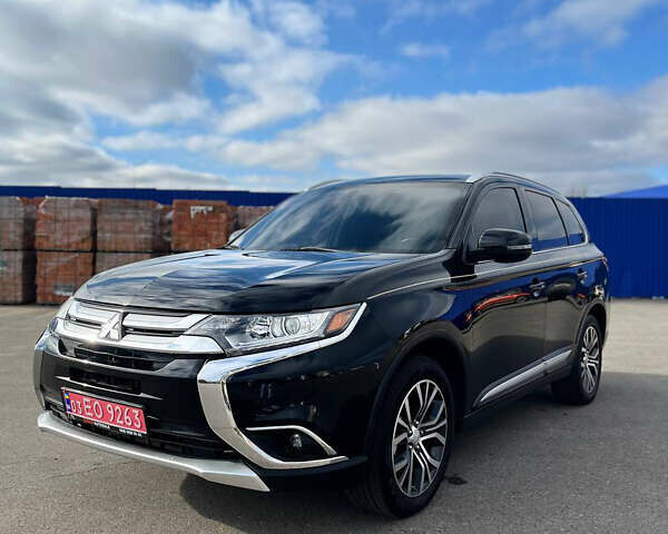 Черный Мицубиси Аутлендер, объемом двигателя 2.36 л и пробегом 91 тыс. км за 15500 $, фото 1 на Automoto.ua