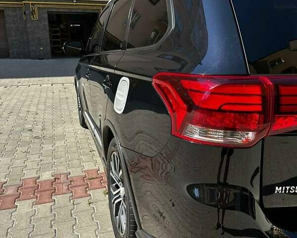 Чорний Міцубісі Аутлендер, об'ємом двигуна 2.36 л та пробігом 225 тис. км за 13699 $, фото 9 на Automoto.ua