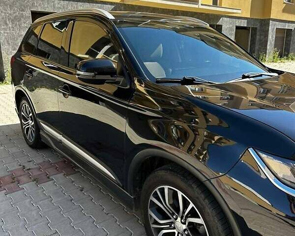 Чорний Міцубісі Аутлендер, об'ємом двигуна 2.36 л та пробігом 225 тис. км за 13699 $, фото 5 на Automoto.ua