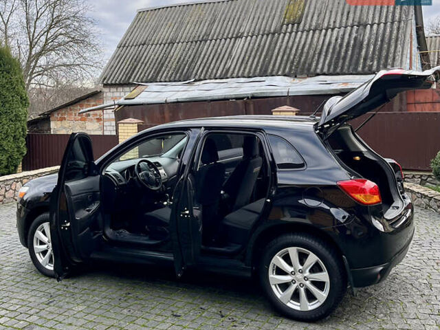 Чорний Міцубісі Аутлендер, об'ємом двигуна 2 л та пробігом 170 тис. км за 10999 $, фото 18 на Automoto.ua