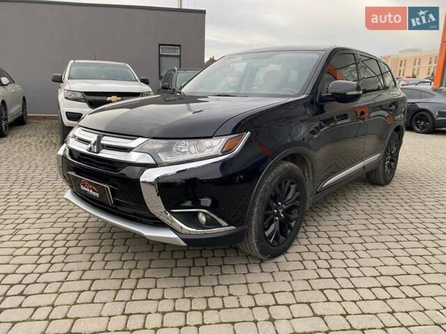 Черный Мицубиси Аутлендер, объемом двигателя 2.36 л и пробегом 143 тыс. км за 12900 $, фото 2 на Automoto.ua