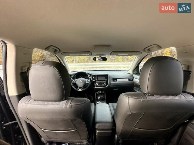 Черный Мицубиси Аутлендер, объемом двигателя 2.36 л и пробегом 119 тыс. км за 15600 $, фото 8 на Automoto.ua