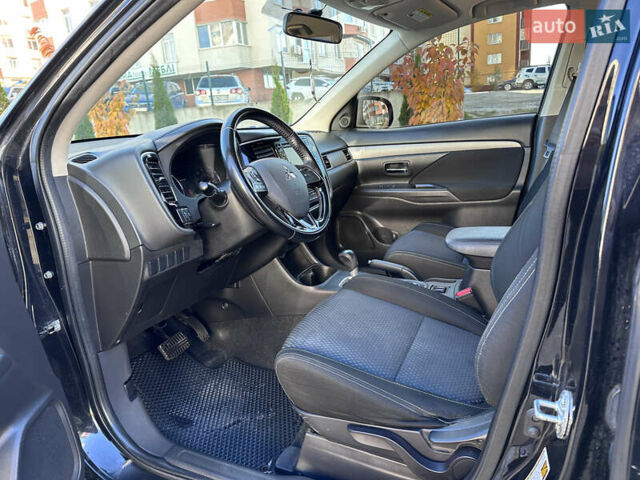 Черный Мицубиси Аутлендер, объемом двигателя 2.36 л и пробегом 150 тыс. км за 14900 $, фото 21 на Automoto.ua