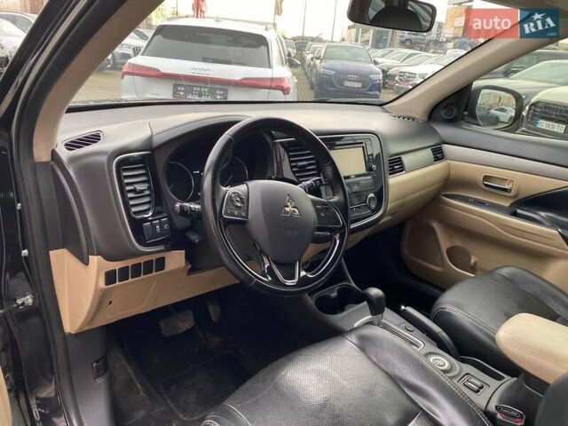 Черный Мицубиси Аутлендер, объемом двигателя 2.36 л и пробегом 143 тыс. км за 12900 $, фото 10 на Automoto.ua