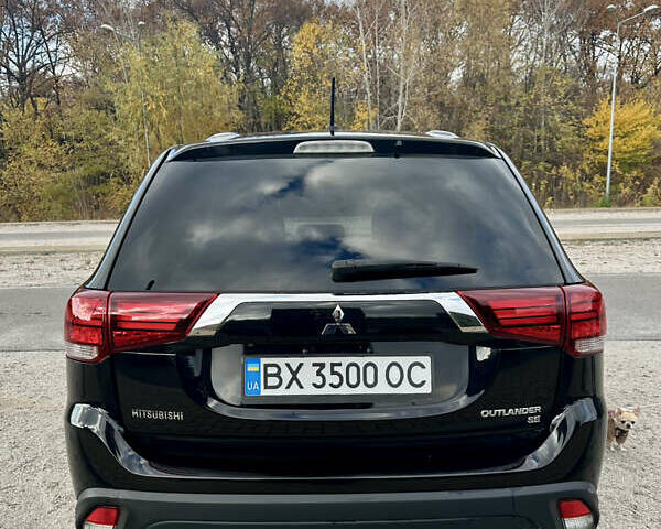 Черный Мицубиси Аутлендер, объемом двигателя 2.36 л и пробегом 119 тыс. км за 15600 $, фото 4 на Automoto.ua