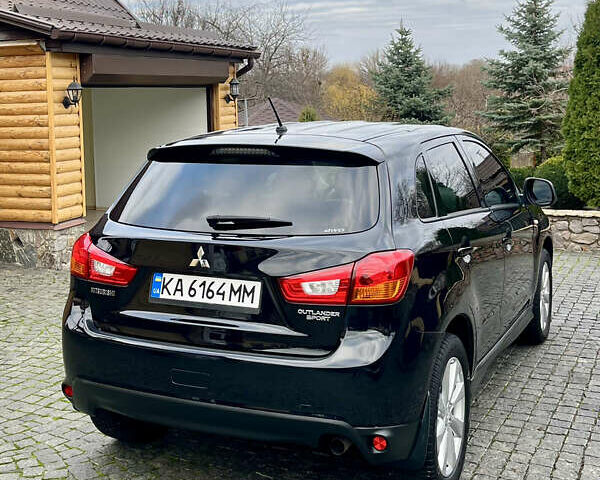 Чорний Міцубісі Аутлендер, об'ємом двигуна 2 л та пробігом 170 тис. км за 10999 $, фото 9 на Automoto.ua
