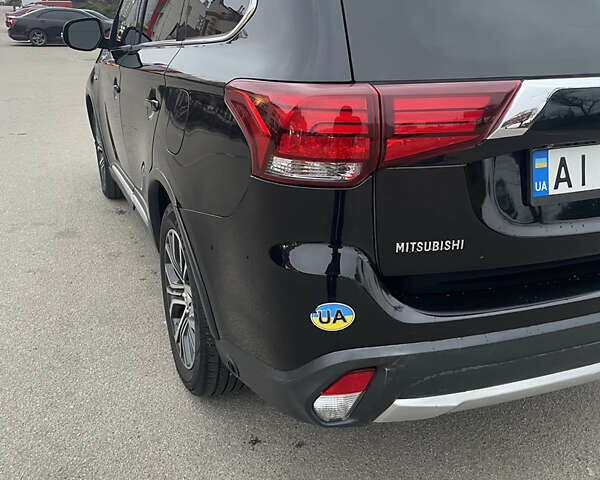Черный Мицубиси Аутлендер, объемом двигателя 3 л и пробегом 260 тыс. км за 13799 $, фото 6 на Automoto.ua