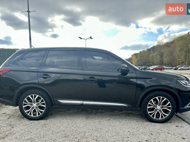 Черный Мицубиси Аутлендер, объемом двигателя 2.36 л и пробегом 119 тыс. км за 15600 $, фото 2 на Automoto.ua