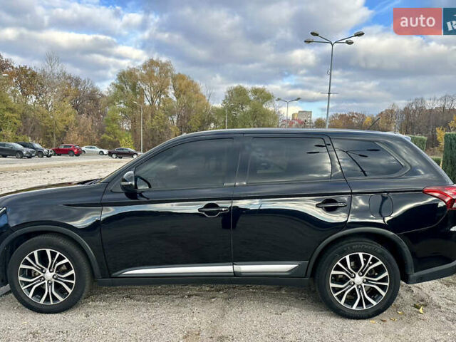 Черный Мицубиси Аутлендер, объемом двигателя 2.36 л и пробегом 119 тыс. км за 15600 $, фото 3 на Automoto.ua