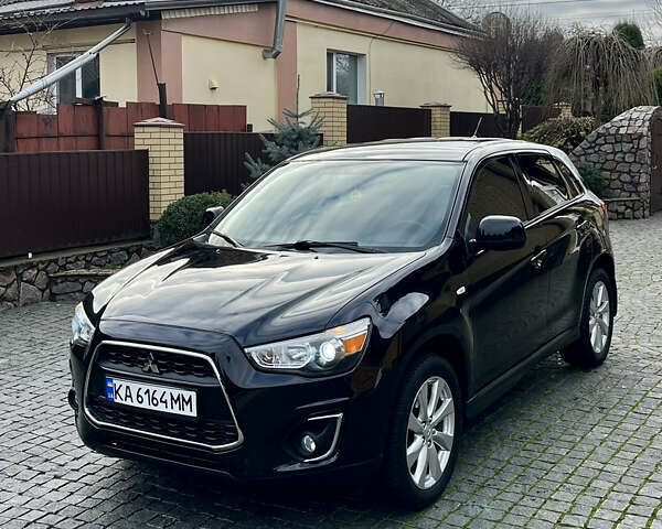 Чорний Міцубісі Аутлендер, об'ємом двигуна 2 л та пробігом 170 тис. км за 10999 $, фото 3 на Automoto.ua