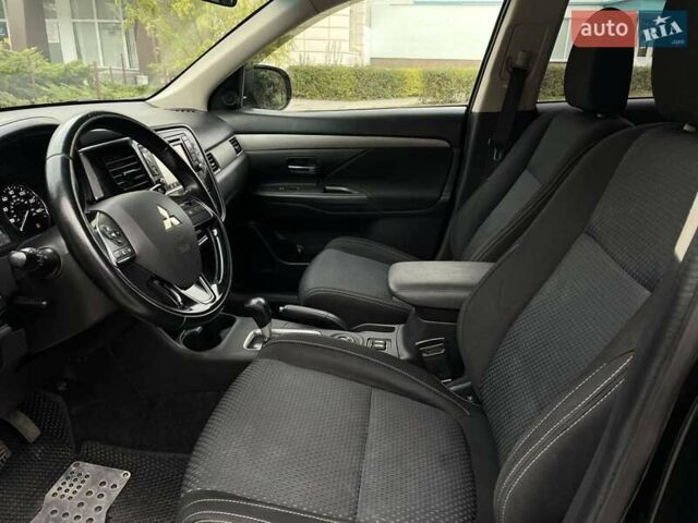 Черный Мицубиси Аутлендер, объемом двигателя 2.36 л и пробегом 167 тыс. км за 13500 $, фото 10 на Automoto.ua