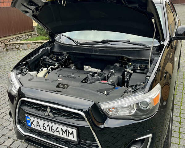 Чорний Міцубісі Аутлендер, об'ємом двигуна 2 л та пробігом 170 тис. км за 10999 $, фото 35 на Automoto.ua