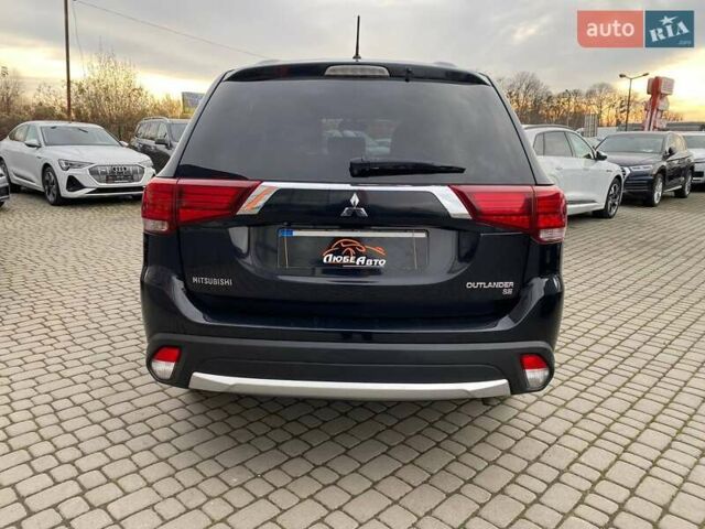 Черный Мицубиси Аутлендер, объемом двигателя 2.36 л и пробегом 143 тыс. км за 12900 $, фото 5 на Automoto.ua