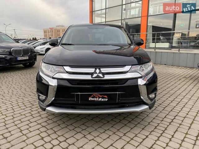 Черный Мицубиси Аутлендер, объемом двигателя 2.36 л и пробегом 143 тыс. км за 12900 $, фото 1 на Automoto.ua