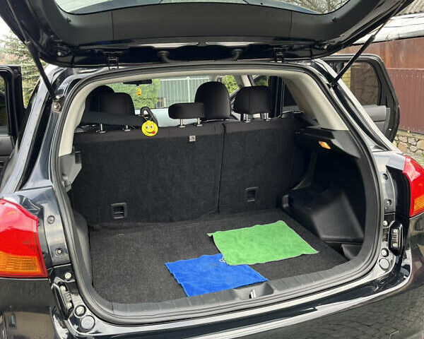 Чорний Міцубісі Аутлендер, об'ємом двигуна 2 л та пробігом 170 тис. км за 10999 $, фото 32 на Automoto.ua