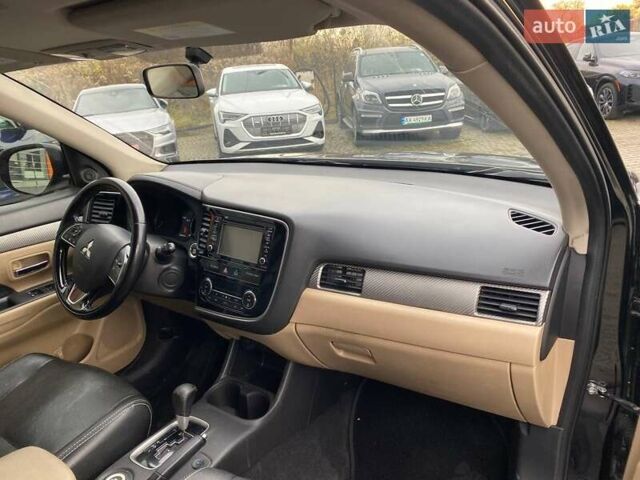 Черный Мицубиси Аутлендер, объемом двигателя 2.36 л и пробегом 143 тыс. км за 12900 $, фото 8 на Automoto.ua