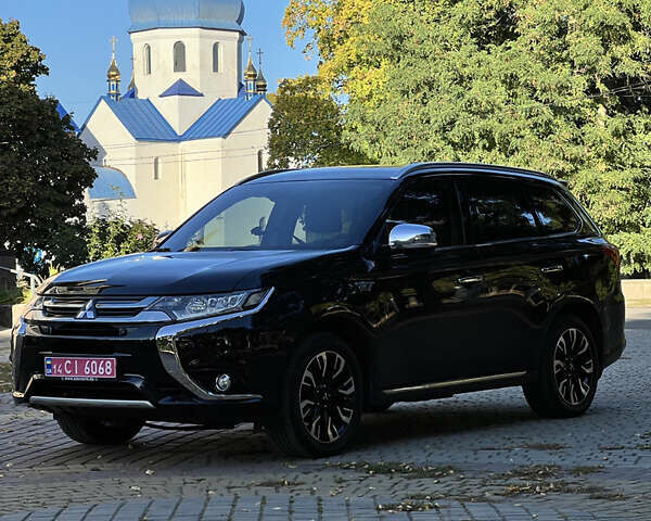 Чорний Міцубісі Аутлендер, об'ємом двигуна 2 л та пробігом 233 тис. км за 18000 $, фото 25 на Automoto.ua