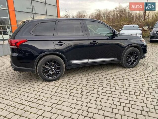 Черный Мицубиси Аутлендер, объемом двигателя 2.36 л и пробегом 143 тыс. км за 12900 $, фото 7 на Automoto.ua