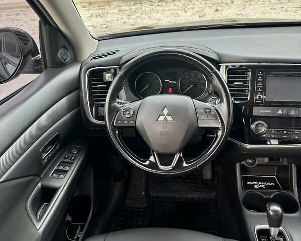 Черный Мицубиси Аутлендер, объемом двигателя 2.36 л и пробегом 119 тыс. км за 15600 $, фото 7 на Automoto.ua