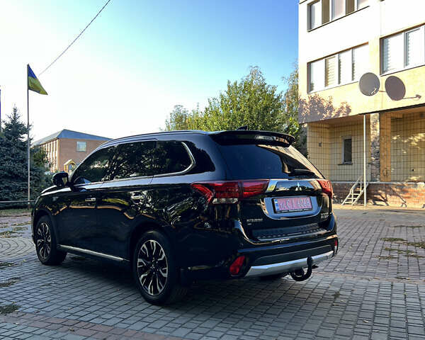 Чорний Міцубісі Аутлендер, об'ємом двигуна 2 л та пробігом 233 тис. км за 18000 $, фото 21 на Automoto.ua
