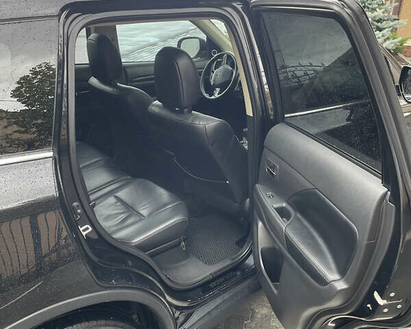 Черный Мицубиси Аутлендер, объемом двигателя 3 л и пробегом 257 тыс. км за 13699 $, фото 13 на Automoto.ua