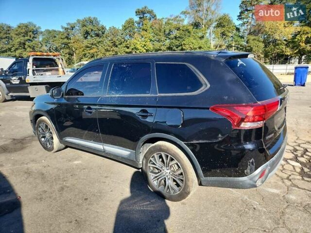 Чорний Міцубісі Аутлендер, об'ємом двигуна 2.36 л та пробігом 99 тис. км за 2100 $, фото 1 на Automoto.ua