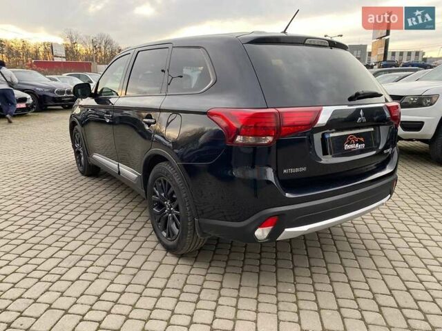 Черный Мицубиси Аутлендер, объемом двигателя 2.36 л и пробегом 143 тыс. км за 12900 $, фото 4 на Automoto.ua