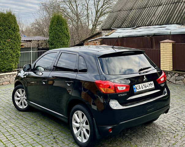 Чорний Міцубісі Аутлендер, об'ємом двигуна 2 л та пробігом 170 тис. км за 10999 $, фото 8 на Automoto.ua